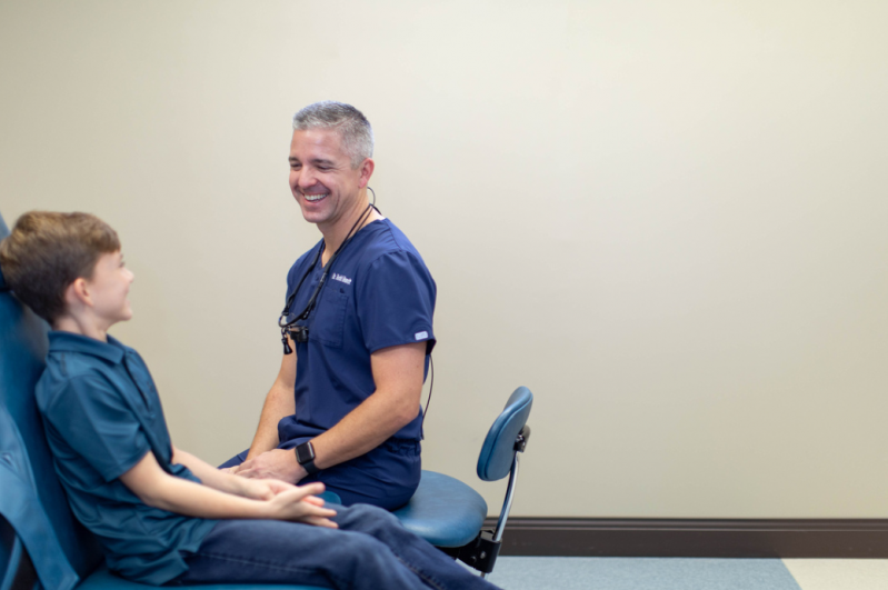 Dr and young boy in examine room